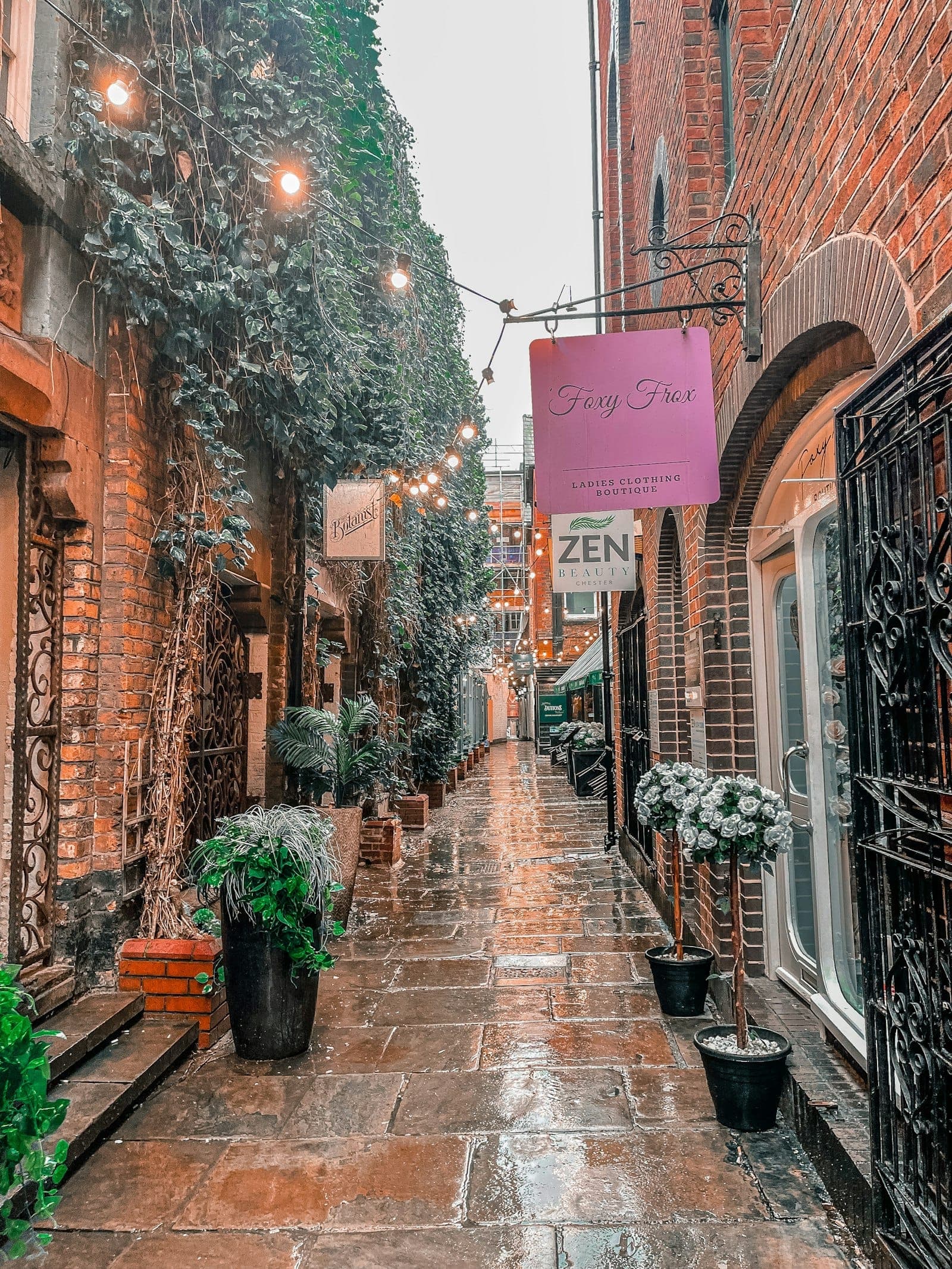 A characterful shopping passage in Chester with sandstone flag paving