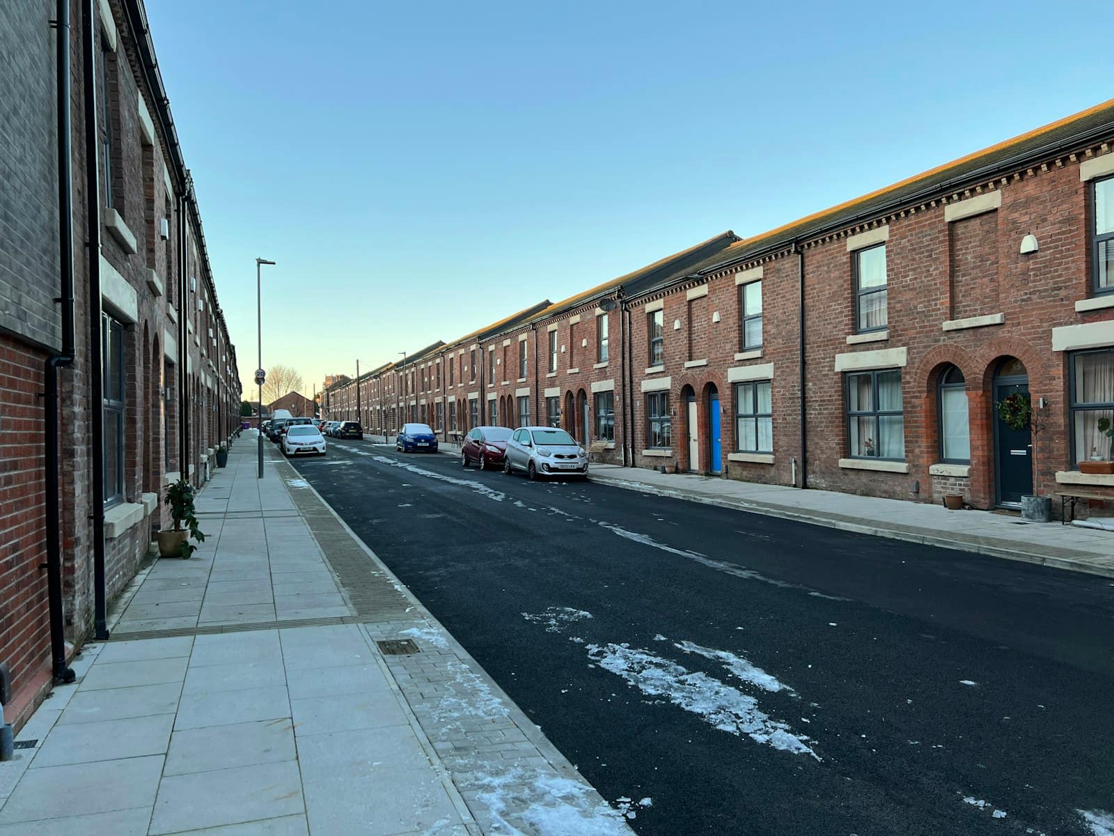 Restored red brick terraced street on a frosty morning